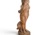 figurine of a young girl holding her hands to her face