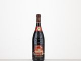 a bottle of wine sitting on top of a table
