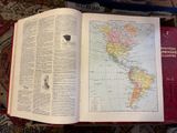 an open book with a map of the world on it