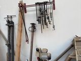 many tools that are hanging on the wall in the room