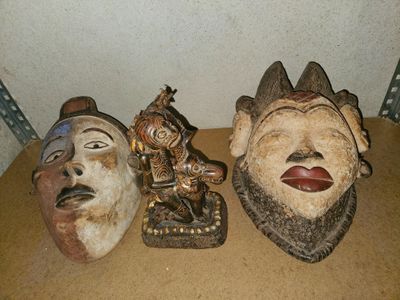 three masks that are sitting on a table