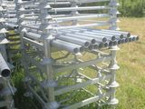 a lot of pipes that are sitting in the grass