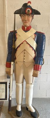 a statue of a man in a uniform with a rifle
