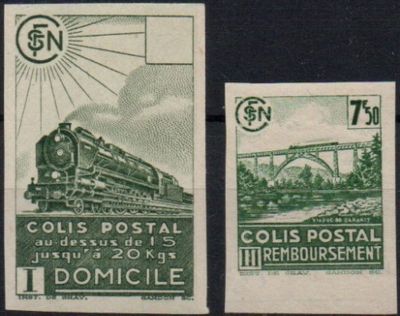 two stamps with a train on them on a black surface