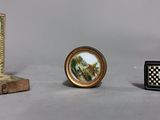 a small box with a picture on it next to a small box with a picture on it