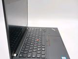 a laptop with a black keyboard on a white surface