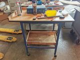 a workbench with tools on top of it in a workshop