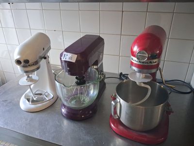 three mixers on the counter in the kitchen