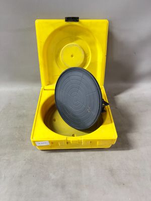 an open yellow box with a black lid and a gray lid