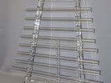 clear acrylic display rack with blue knobs on a white surface