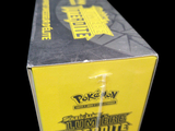 a box of pokemon trading cards on a black background
