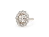 a close up of a diamond ring on a white background