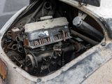 a small engine in the back of an old car