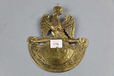 an image of a gold plate with an eagle on it