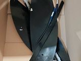 a cardboard box with a pair of skis inside of it