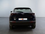 the back end of a black mazda cx - 5 parked in a white room