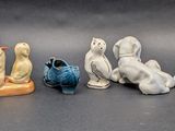 many figurines of animals that are sitting on a table