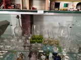a glass display case filled with different types of glassware