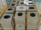 many boxes stacked on top of each other in a room