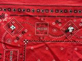 red bandanna with black and white mickey mouses on it