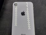 a white iphone that is sitting on a table