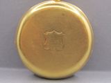 a gold colored pocket watch with a gold chain on it