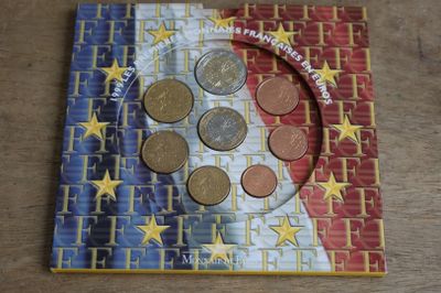 a picture of a book with a picture of a flag and coins on it