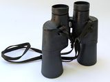 a pair of binoculars sitting on a white surface
