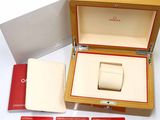 a box with a watch inside of it on a table