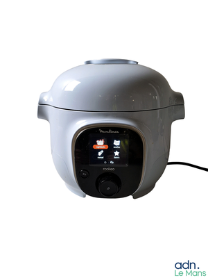 a white rice cooker sitting on a white surface