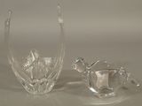 two glass vases that are sitting on a table