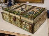 a box that is sitting on a table in front of a painting
