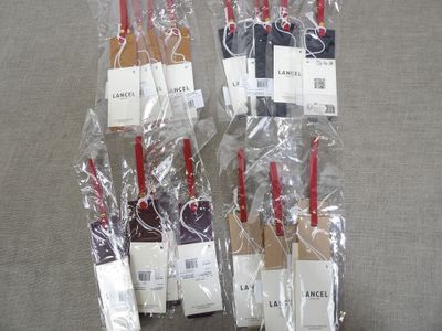 four wine bottles wrapped in plastic bags on a table