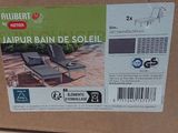a box that has a pair of lounge chairs in it