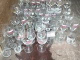 many empty wine glasses sitting on the floor next to a cardboard box