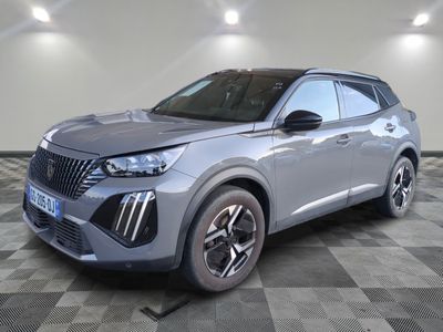 a silver suv parked in a room with a checkered floor