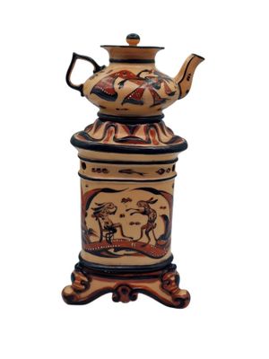 an image of a decorative tea pot on a stand on a white background