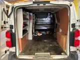 the back of a van with the door open and the back of the van with the back door open