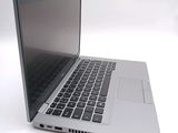a close up of a laptop computer on a white surface