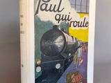la couverture d'un livre sur laquelle figure l'image d'un train qui arrive sur les rails