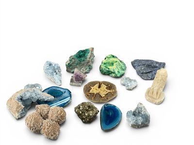 many different types of rocks and stones on a white surface