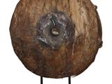 a large piece of wood that is on a stand