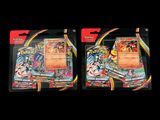 two packs of pokemon trading cards on a black background