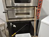 a stack of three ovens sitting next to each other in a kitchen