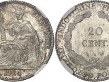 a silver coin with the image of a woman sitting on a chair