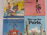 Quatre livres pour enfants, en français et en anglais, sont posés sur une table
