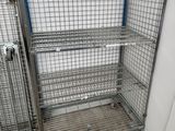a metal shelf with a wire cage on it