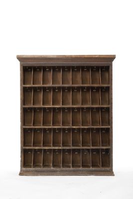 an old wooden bookcase with lots of compartments on top of it