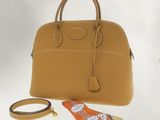 beige leather handbag with matching belt and matching purse strap