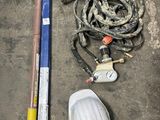 a fire hydrant, a hose, and a hose on the ground
